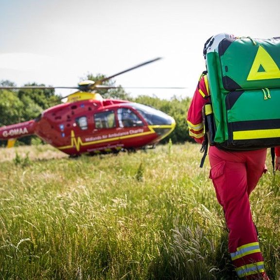 Air-ambulance-doctor-walking-to-helicopter